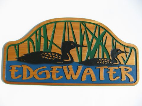 Wooden engraved cottage sign edgewater loons reeds water